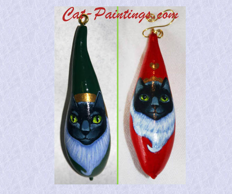 Two gourds painted with cats as a Christmas tree decoration
